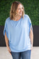 Darcy Dolman Top with trendy flowy sleeves and solid sky blue color, offering superb stretch and comfort for any occasion, from work to evening outings