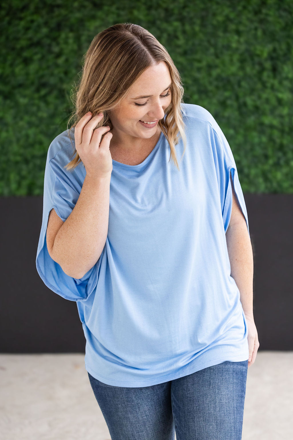 Darcy Dolman Top with trendy flowy sleeves and solid sky blue color, offering superb stretch and comfort for any occasion, from work to evening outings