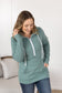 Sage color Pixie Pocket Halfzip Hoodie with triple stretch fabric, pocket on the sleeve, kangaroo pocket, and a feminine fit for comfort and style.